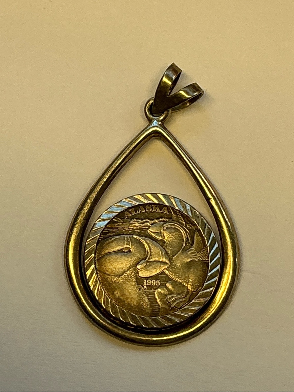 Authentic 1/10 Troy ounce 1995 Alaska State Medallion in Sterling Bezel Frame.